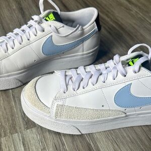 Nike White Low-Top Sneakers with Light Blue Swoosh